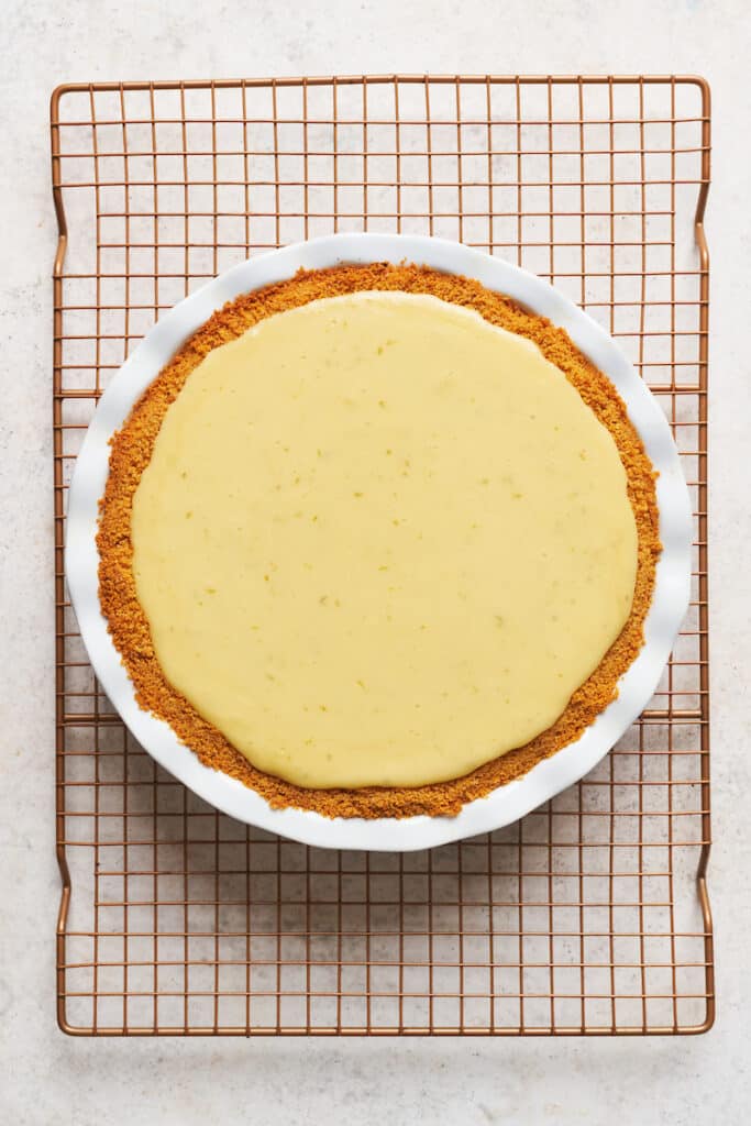 Key lime pie on a cooling rack.