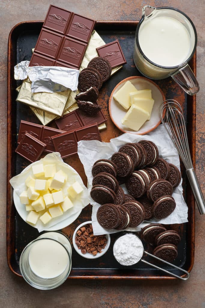 Ingredients for chocolate cream pie on a baking sheet.