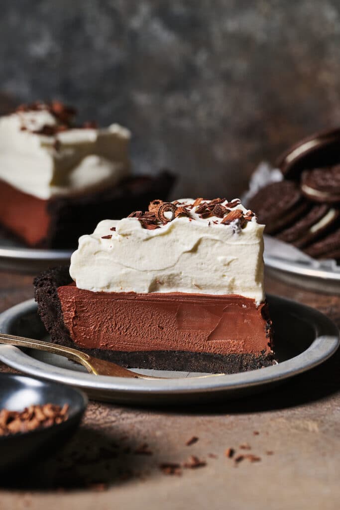 Slice of chocolate cream pie in a baking dish.