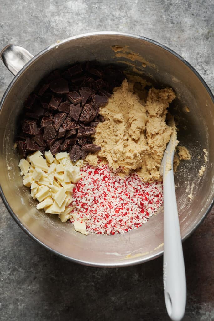 Candy cane cookies cookie dough in a large bowl.